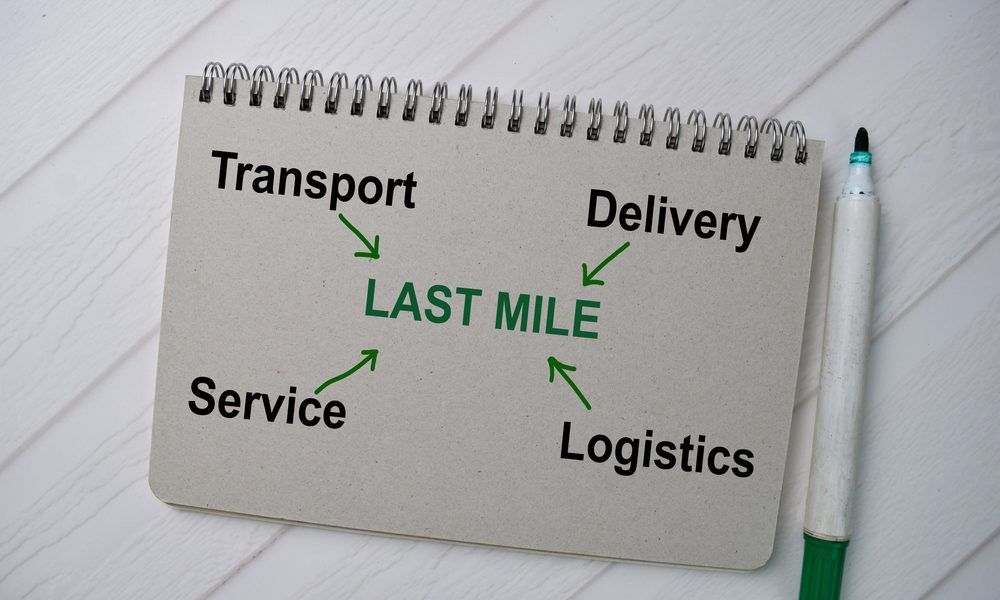 Last-mile delivery rider handing a parcel to a customer